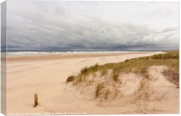 Storm Brewing Over Castlerock Beach Canvas Print by jim Hamilton