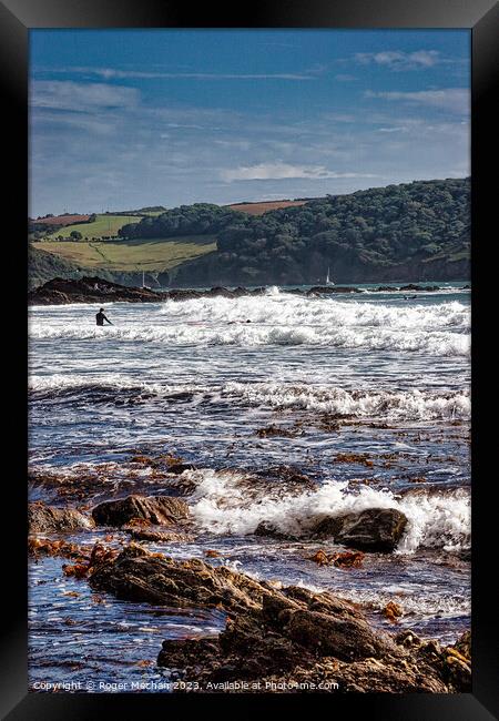Surfing a stormy Wembury Beach Devon Framed Print by Roger Mechan
