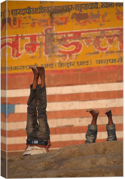 Doing Yoga on the Ghats at Varanasi Canvas Print by Serena Bowles