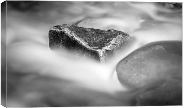 Rock Surrounded by Flowing Water Canvas Print by Kevin Howchin