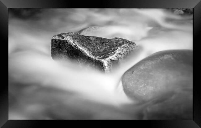 Rock Surrounded by Flowing Water Framed Print by Kevin Howchin
