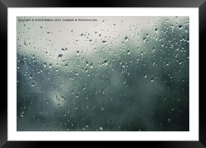 Rain drops on a window with blurry background Framed Mounted Print by Kristof Bellens