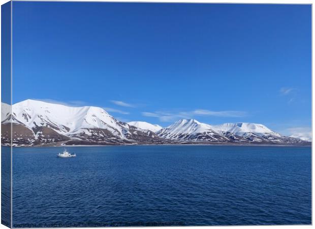Serene Winter Landscape: Majestic Mountains, Pristine Snow, and Tranquil Sea a view from svalbard and jan mayen norway Canvas Print by Anish Punchayil Sukumaran