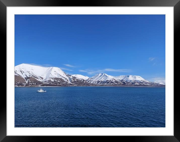 Serene Winter Landscape: Majestic Mountains, Pristine Snow, and Tranquil Sea a view from svalbard and jan mayen norway Framed Mounted Print by Anish Punchayil Sukumaran