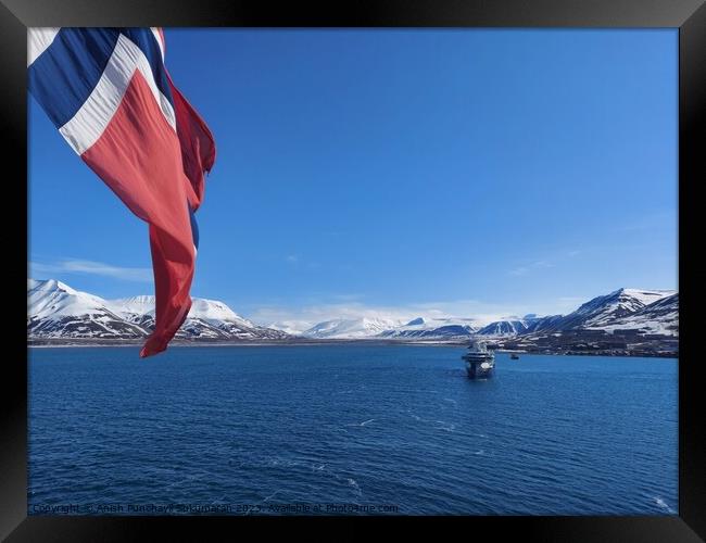 Norwegian Winter: Majestic Mountain Flag in Blue Sky a view from svalbard and jan mayen Framed Print by Anish Punchayil Sukumaran