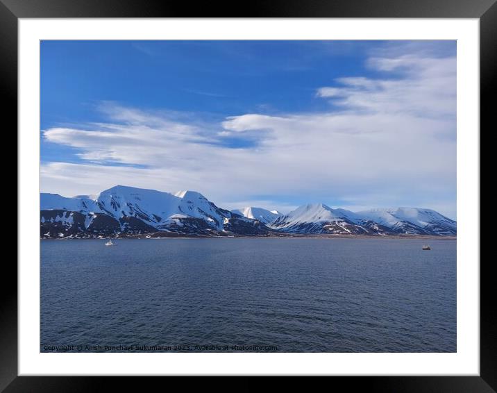 Architectural beauty against mountainous coastline with nautical vessel sailing on calm waters. a view from salbard longyearbyen norway Framed Mounted Print by Anish Punchayil Sukumaran