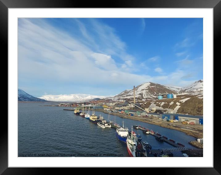 Norway salbard longyearbyen 2 june 2023Coastal landscape with ship, beach, mountain, and architectural building under sunny sky. Framed Mounted Print by Anish Punchayil Sukumaran
