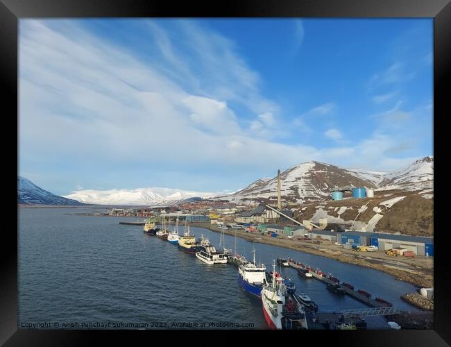 Norway salbard longyearbyen 2 june 2023Coastal landscape with ship, beach, mountain, and architectural building under sunny sky. Framed Print by Anish Punchayil Sukumaran