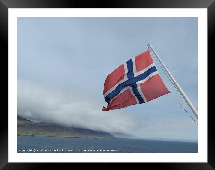 Norwegian Flag Fluttering Proudly Against Clear Blue Sky Framed Mounted Print by Anish Punchayil Sukumaran