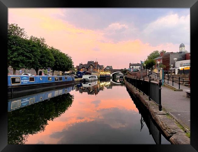 Sunset on busy canal Framed Print by Leonard Hall