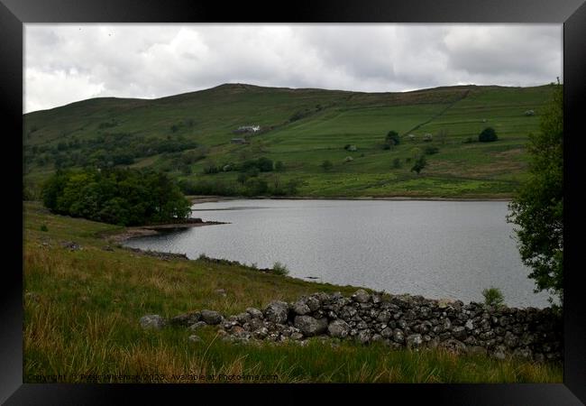 View over Wet Sleddale Reservoir towards Sleddale Hall  in the distance Framed Print by Peter Wiseman