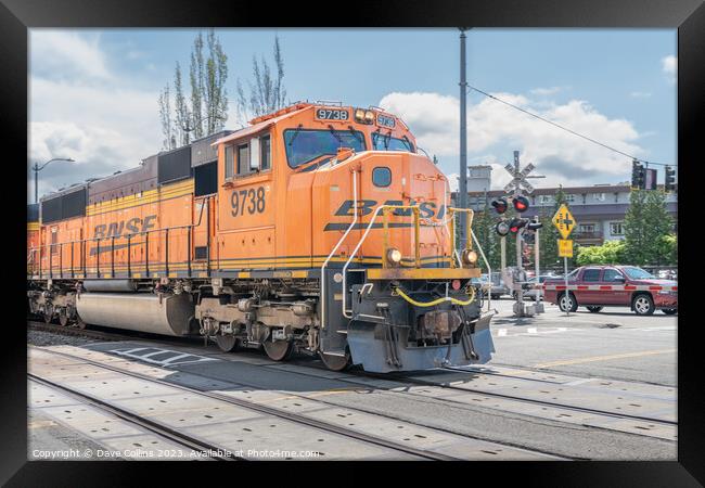 BNSF freight train passing through Seattle along Alaskan Way highway, Seattle, USA Framed Print by Dave Collins