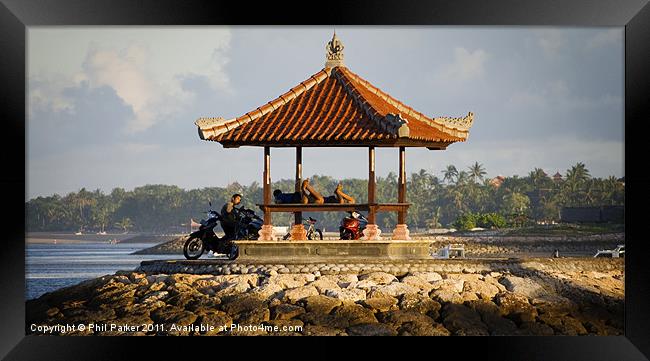 Locals Relaxing in Bali Framed Print by Phil Parker