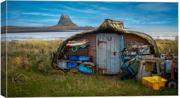 Lindisfarne Boatshed and Castle Canvas Print by John Frid