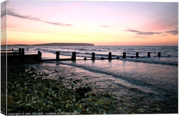 Dawn at Sandown bay, Isle of Wight Canvas Print by john hill