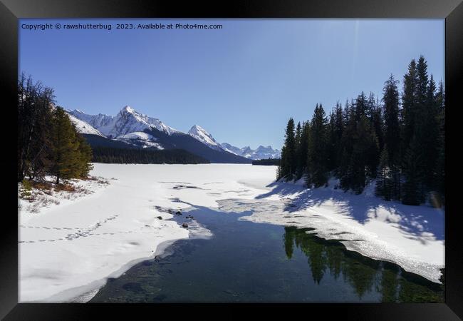 Snowy Maligne Lake Amidst White Peaks Framed Print by rawshutterbug 