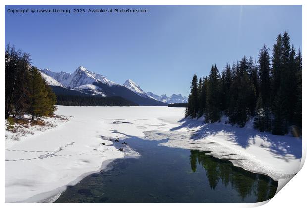 Snowy Maligne Lake Amidst White Peaks Print by rawshutterbug 