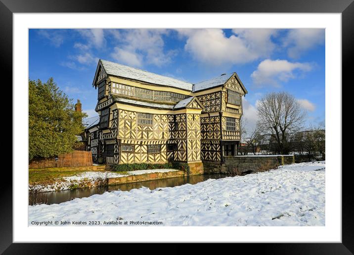Little Moreton Hall, Cheshire in the winter snow.  Framed Mounted Print by John Keates