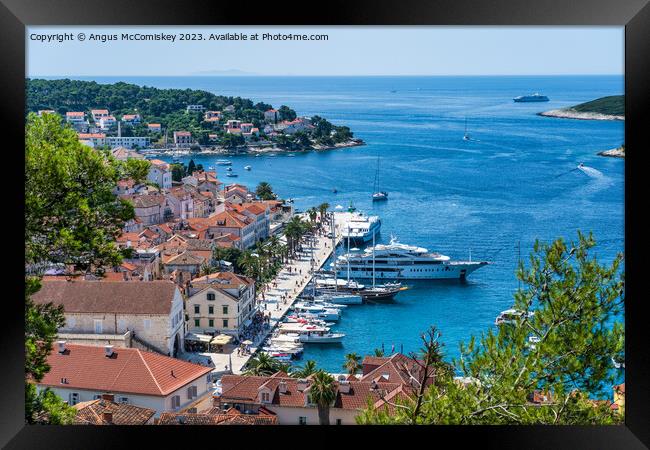 Boats on Riva waterfront in Hvar town, Croatia Framed Print by Angus McComiskey