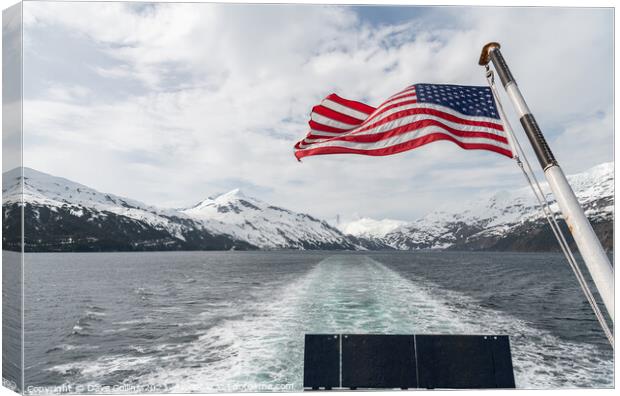 American Stars and Stripes flag on the back of a boat in Price William Sound, Alaksa, USA Canvas Print by Dave Collins