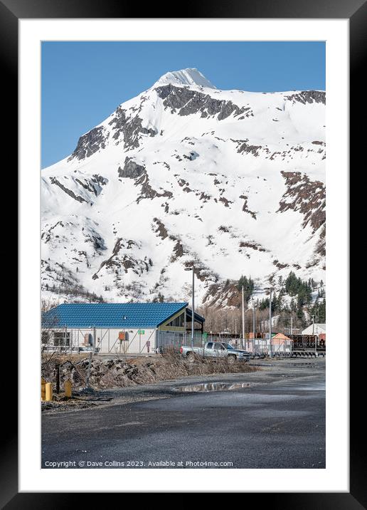 Industrial buildings in the town with snow a covered mountain in the background, Whittier, Alaska, USA Framed Mounted Print by Dave Collins