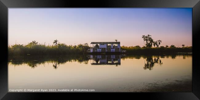 Tranquil Journey Along The Okavango Delta. Framed Print by Margaret Ryan