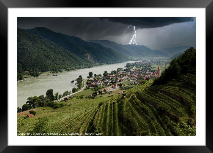 Thunderstorm with lightning over Weissenkirchen village. Framed Mounted Print by Sergey Fedoskin
