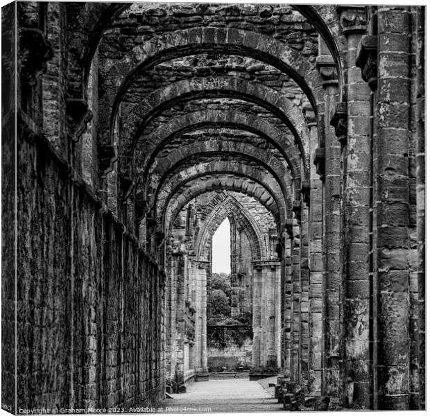 Fountains Abbey interior of nave north aisle Canvas Print by Graham Moore