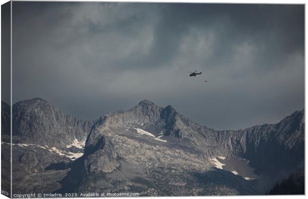 Moody Swiss Mountain with Helicopter Canvas Print by Imladris 