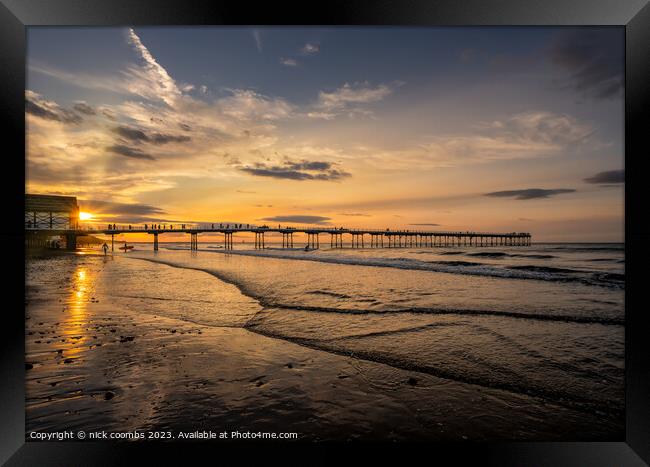 Saltburn pier and Surfer Framed Print by nick coombs