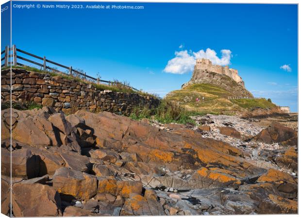 Lindisfarne Castle seen from the shore line Canvas Print by Navin Mistry