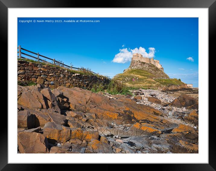 Lindisfarne Castle seen from the shore line Framed Mounted Print by Navin Mistry