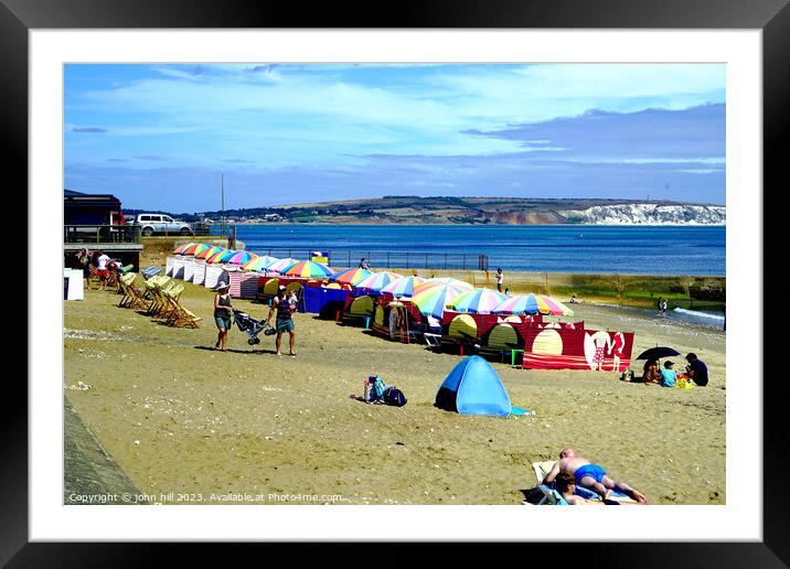 Vibrant Umbrellas Adorning Shanklin Seashore Framed Mounted Print by john hill