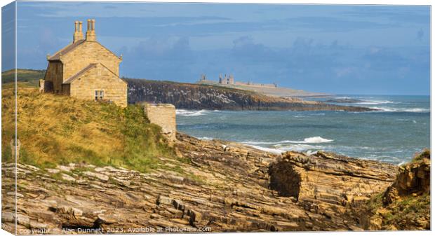 Coastal Embrace: Ocean Meets Rocky Shore at Rumbli Canvas Print by Alan Dunnett