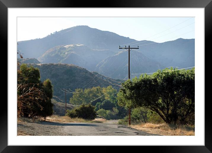 Empty road leading through Ed Davis Park in Califo Framed Mounted Print by Lensw0rld 