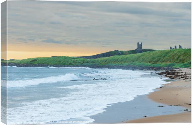 Coastal Serenity Unveiled at Dunstanburgh Canvas Print by Alan Dunnett