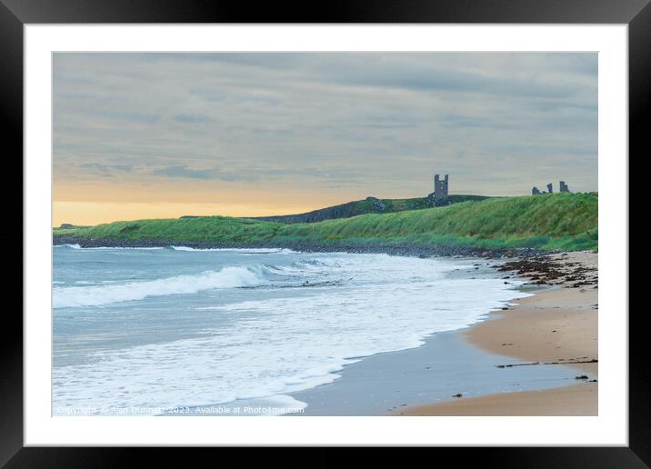 Coastal Serenity Unveiled at Dunstanburgh Framed Mounted Print by Alan Dunnett
