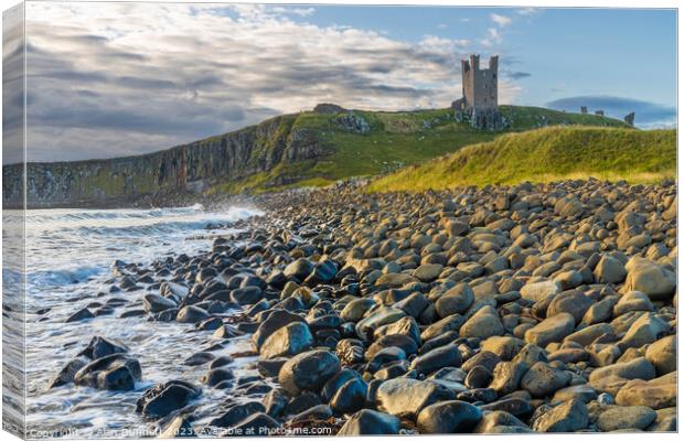 Dawn's Symphony at Dunstanburgh Beach Canvas Print by Alan Dunnett