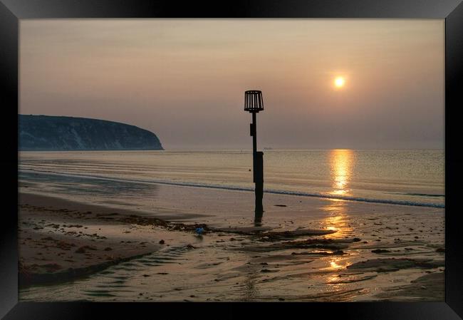 Sunrise over Swanage Bay, Dorset Framed Print by Darren Galpin
