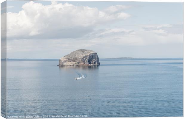 A small motor boat leaving Bass Rock, Firth of Forth, Scotland Canvas Print by Dave Collins
