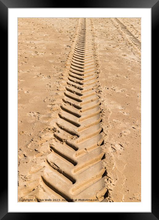 Tracks in the sand Framed Mounted Print by Clive Wells