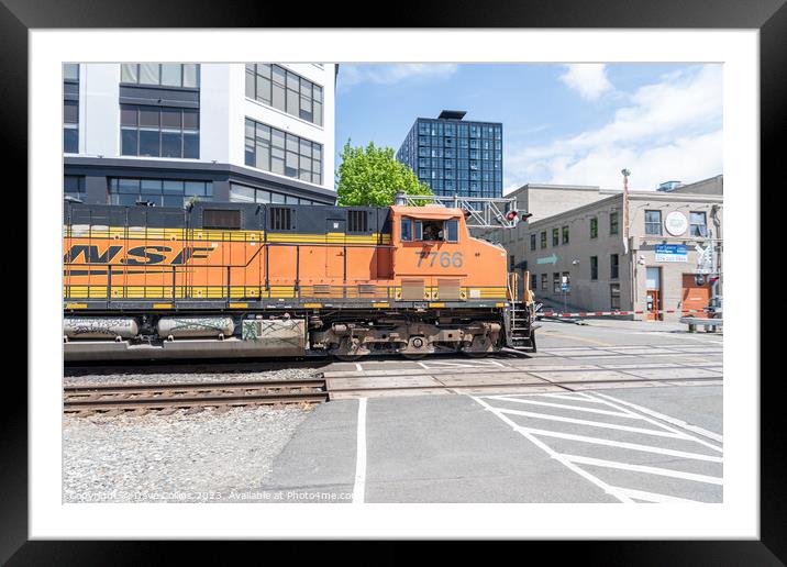 BNSF freight train on a level crossing from Alaskan Way, Seattle, USA Framed Mounted Print by Dave Collins