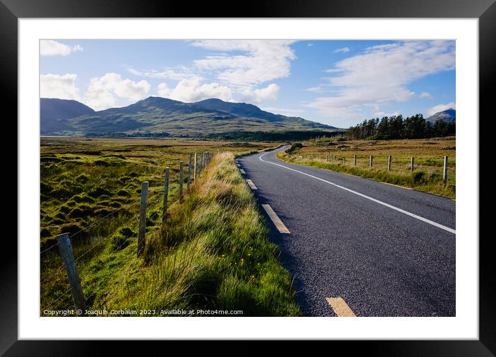 Travelers in search of solitude and nature are enchanted by the Irish roads. Framed Mounted Print by Joaquin Corbalan