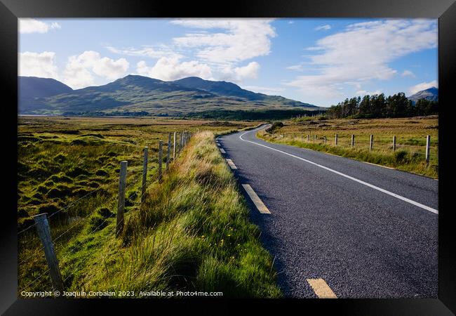 Travelers in search of solitude and nature are enchanted by the Irish roads. Framed Print by Joaquin Corbalan