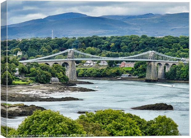 Crossing the Iconic Menai Bridge Anglesey Canvas Print by Roger Mechan