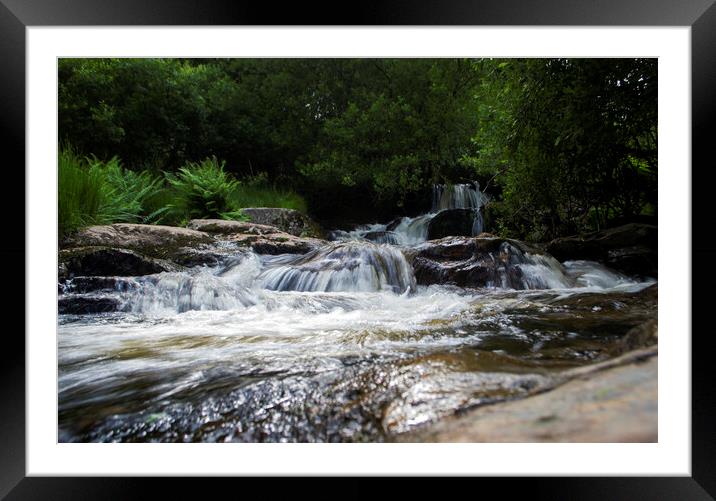 A waterfall going over a body of water Framed Mounted Print by Victoria Bowie