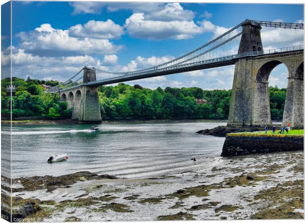 Menai suspension bridge Wales from the foreshore Canvas Print by Roger Mechan