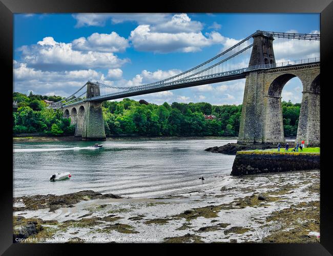 Menai suspension bridge Wales from the foreshore Framed Print by Roger Mechan