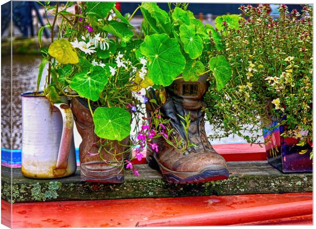 Trekking boots recycled as a cottage garden Canvas Print by Steve Painter