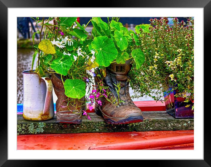 Trekking boots recycled as a cottage garden Framed Mounted Print by Steve Painter